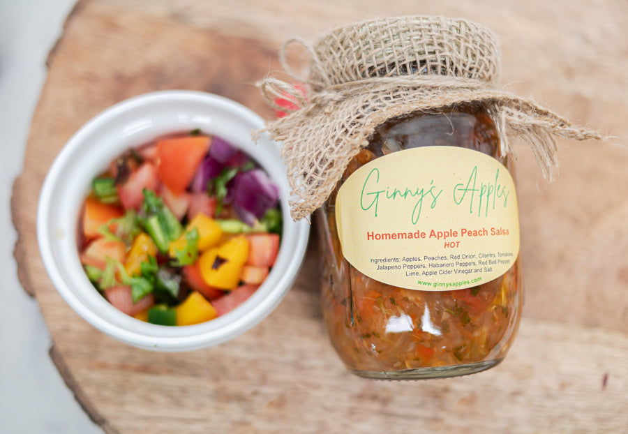 A bowl of Apple Peach Salsa next to its jar